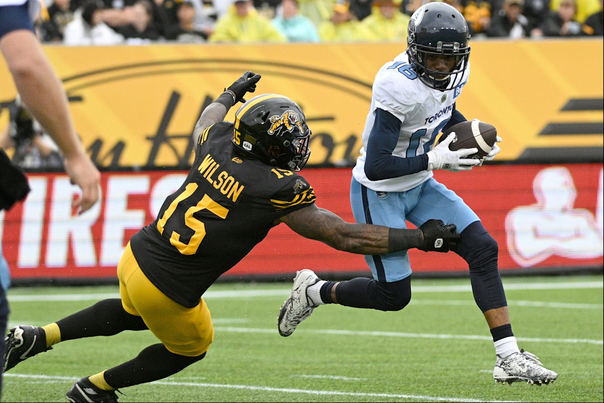 Football_CFL_Toronto Argonauts wide receiver Brandon Banks and Hamilton Tiger-Cats linebacker Kyle Wilson 